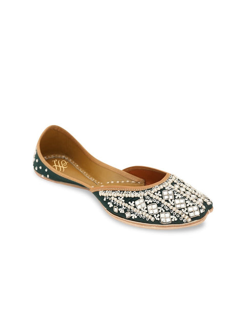 A pair of green embellished round toe flats