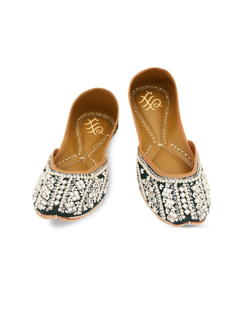 A pair of green embellished round toe flats