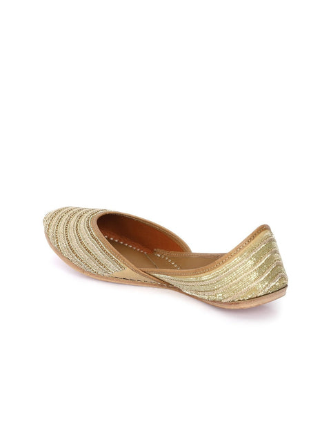A pair of gold-toned embellished ethnic mojaris